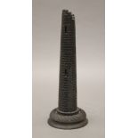 An Irish bog oak carving of ruined tower. 22.5 cm high.