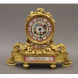 A 19th century porcelain mounted ormolu mantle clock. 23 cm high.