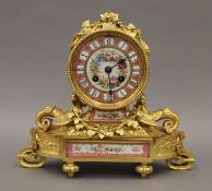 A 19th century porcelain mounted ormolu mantle clock. 23 cm high.