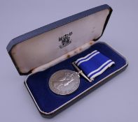 A police Long Service and Good Conduct medal, boxed.