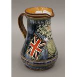 A Doulton Lambeth Flag of Pretoria jug. 20 cm high.