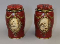 A pair of red tea tins. 16.5 cm high.