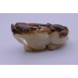 A Chinese carved jade dog-of-fo. 6.5 cm long.