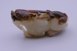 A Chinese carved jade dog-of-fo. 6.5 cm long.