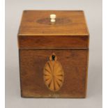A small cube shaped George III inlaid mahogany tea caddy. 10 cm wide.