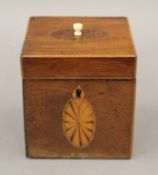 A small cube shaped George III inlaid mahogany tea caddy. 10 cm wide.