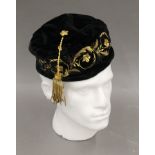 A black Lock & Co of St James's Street velvet and quilt lined embroidered smoking cap.