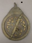 A Chinese brass dial.