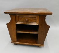 A mid-20th century display cabinet and a coffee table. The former 104 cm wide.