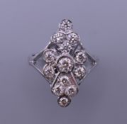 An 18 ct white gold diamond marquis shape ring. Ring size O/P.