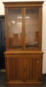 A Victorian oak bookcase cabinet. 226 cm high x 109 cm wide.