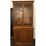 A Victorian oak bookcase cabinet. 226 cm high x 109 cm wide.