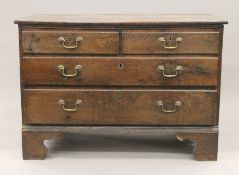 A Georgian oak chest of drawers. 107 cm wide.