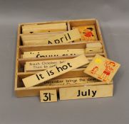 A quantity of wooden child's educational slides/teaching aids.