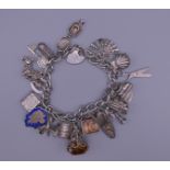 A silver charm bracelet. 76.1 grammes.