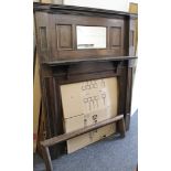 A late 19th/early 20th century oak fire surround. 149 cm wide x 183 cm high.