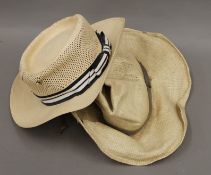 Two Panama straw hats, one by Adam, the other by Borsolino. Sizes 7 1/8 and 7 1/2.