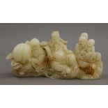 A Chinese carved jade figural brush rest. 16 cm wide.