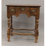 An 18th century and later walnut lowboy. 68 cm wide.