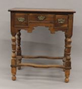 An 18th century and later walnut lowboy. 68 cm wide.