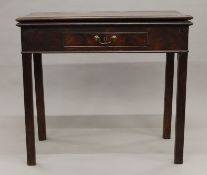 A George III mahogany fold over tea table. 83.5 cm wide.