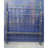 A brass and iron double bed (lacking rails),