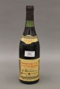 A 1985 bottle of Nuits-Saint-Georges Premier Cru wine. 29.5 cm high.