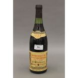 A 1985 bottle of Nuits-Saint-Georges Premier Cru wine. 29.5 cm high.