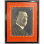 A portrait photograph of Adolf Hitler, framed. 46 x 59 cm overall.