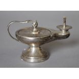 A silver table lighter formed as a lamp. 11 cm long. 112.7 grammes total weight.