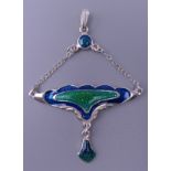 An Art Nouveau style silver pendant. 5 cm high.