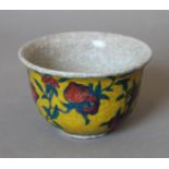 A Chinese yellow ground porcelain tea bowl. 9 cm diameter.
