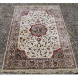 A gold ground full pile Kashmir floral central medallion rug.