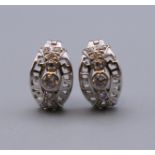 A pair of 9 ct white gold stone set earrings. 1.2 cm high. 2.7 grammes total weight.