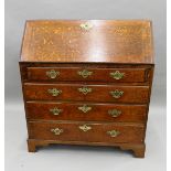 A George III oak bureau. 95.5 cm wide.