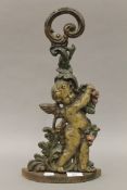 A Victorian cast iron door stop formed as a cherub. 41 cm high.