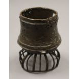 A patinated bronze sculptural urn. 15 cm high.