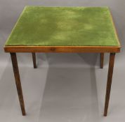 A vintage folding card table. 76 cm square.