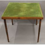 A vintage folding card table. 76 cm square.