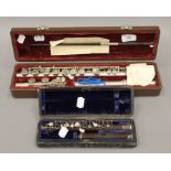 A cased Victorian flute by Rudall Carte & Co and a cased piccolo.