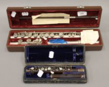 A cased Victorian flute by Rudall Carte & Co and a cased piccolo.