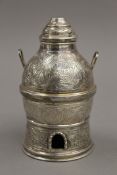 An Indian silver twin handled vessel on stand. 12 cm high overall. 157.3 grammes.