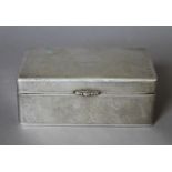 A Chinese silver cigarette box. 15.5 cm wide. 595.2 grammes total weight.