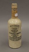 A Victorian stoneware household ammonia bottle. 27 cm high.