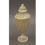 A Royal Worcester blush ivory porcelain reticulated lidded vase. 23 cm high.