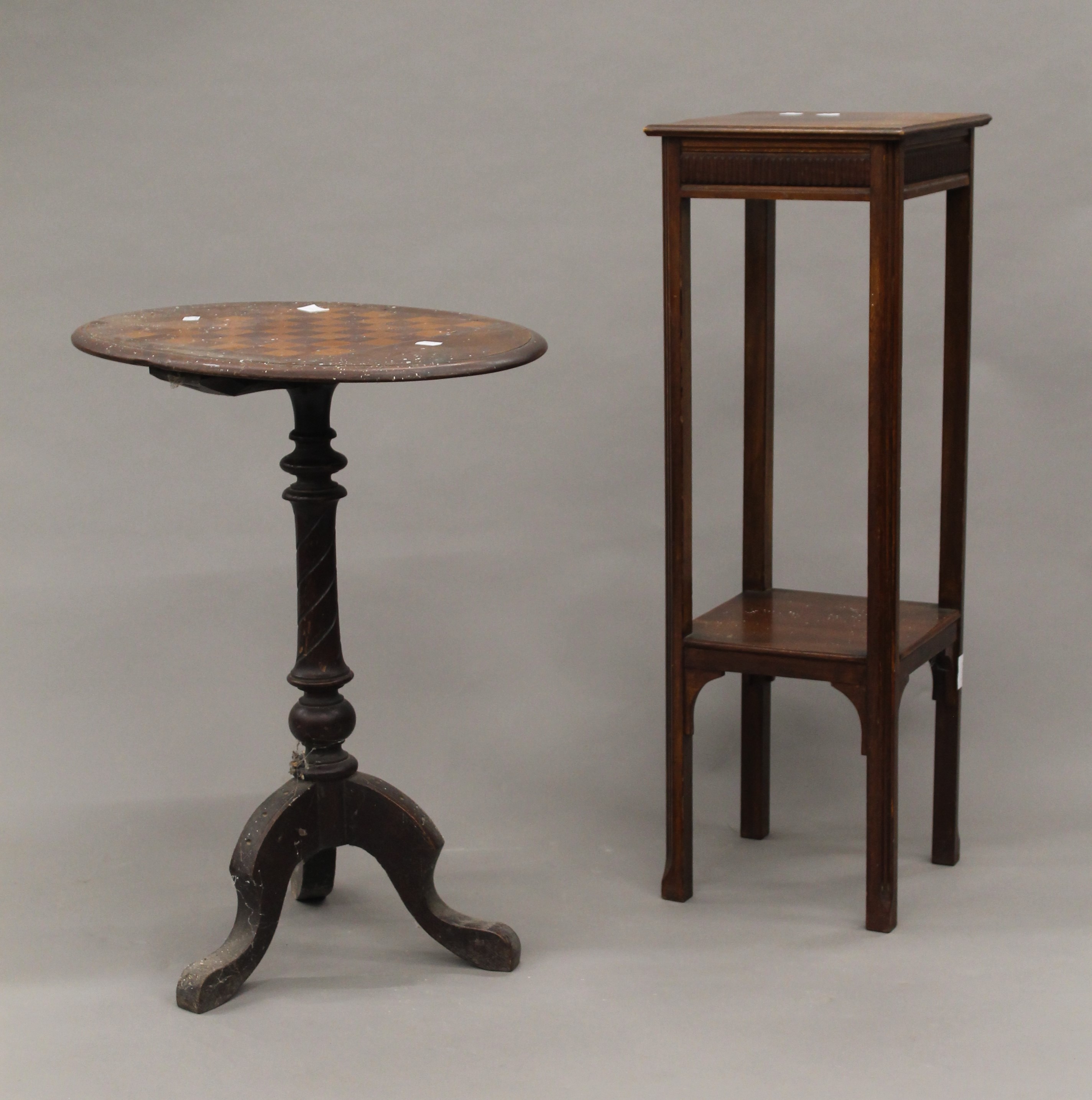 A Victorian inlaid chess table and a jardiniere stand. The latter 86.5 cm high.