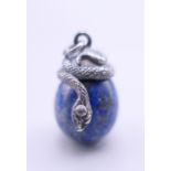 A lapis egg pendant mounted with a snake. 3 cm high.