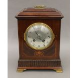 An Edwardian inlaid mahogany mantle clock. 29 cm high.