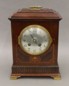 An Edwardian inlaid mahogany mantle clock. 29 cm high.