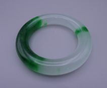 A jade bangle. 9 cm exterior diameter and 6 cm interior diameter.